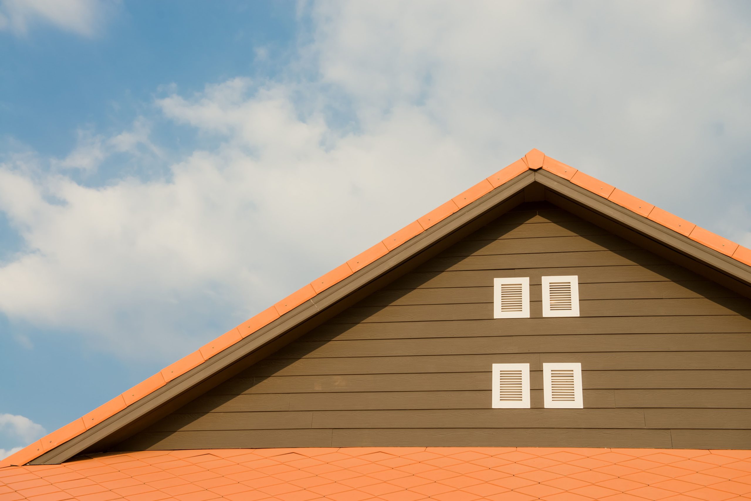 orange and gray painted roof under cloudy 347152 min scaled